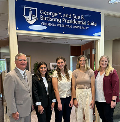 President Miller with Chief of Staff/ Vice President for Strategic Initiatives Kelly Cordova and current graduate interns Camille Jernigan ’25, Ashleigh Lockard ’25, and Adrianna Gunther ’25.