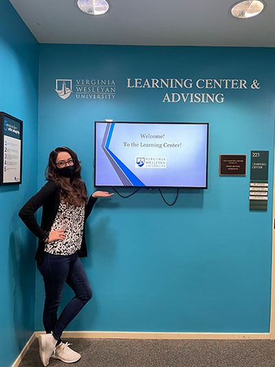 Jamie at the main entrance of The Learning Center, March 2021. (Photo by Emily Duval) Jamie at the main entrance of The Learning Center, March 2021. (Photo by Emily Duval)