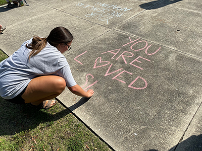 Students draw messages of hope and encouragement during Suicide Awareness Month.